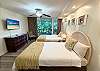 Island elegance meets soft comfort in this restful retreat with tropical touches.