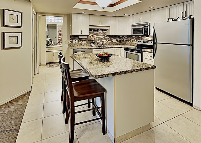 Enjoy serving your guests at the kitchen countertop with bar seating for two.
