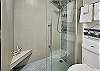 Freshen up for your next adventure in this large glass walk-in shower