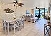 Gather around the rectangular wood dining table, with seating for six beside the living area.
