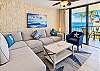 Living room seating includes a cushioned sectional and armchair with room for five. 