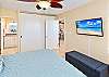 The primary bedroom pairs a king bed with a closet for unpacking during your stay.