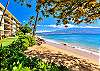 Ocean and island views from the shared grounds at Kanai A Nalu, stepping directly onto the golden sands of Haycraft Beach Park.