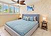 Settle into a king bed in this light filled primary bedroom with bedside lamps.