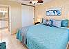 The guest bedroom pairs soft coastal colors with a King bed and closet space.