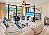 A flat screen TV faces the sectional, with a coffee table within reach for relaxed evenings indoors.