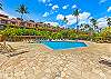 Relax poolside under swaying palms and blue skies.