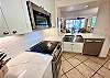 Stainless steel appliances complete your fully stocked kitchen.