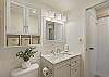 Relax in this serene bathroom, complete with luxurious fixtures and Hawaiian charm