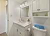 Relax in this serene bathroom, complete with luxurious fixtures and Hawaiian charm