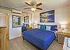 Relax in style in this charming bedroom designed with comfort and tropical elegance