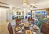 Charming and spacious living room with Hawaiian decor and plenty of natural light
