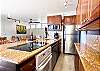 Modern elegance meets functionality in this open kitchen with stunning details.