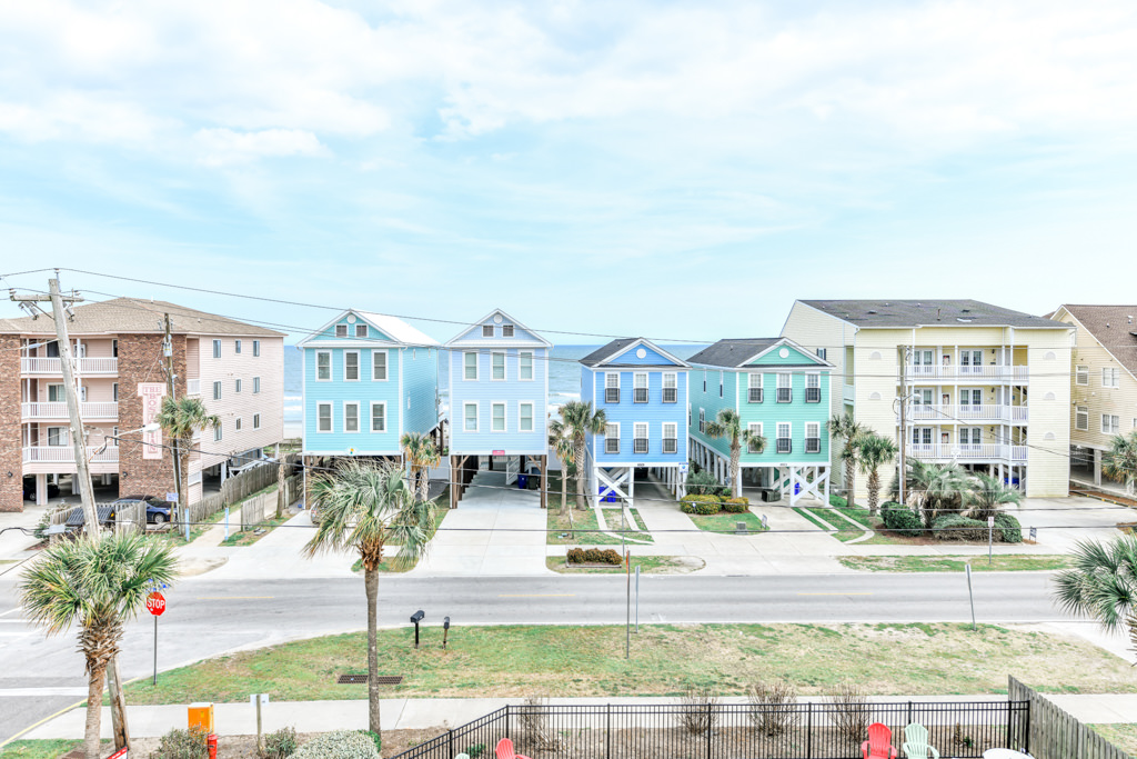 Airel view of a row of brightly colored condos in Surfside Beach South Carolina