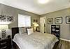 Master bedroom has a king bed. Just off the master bedroom is a bathroom with walk-in shower and single vanity.