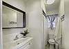 SUMMER DELIGHT is a two bedroom, one bath condo. The bathroom has a vanity and tub/shower combination.