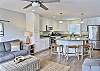 A bright, open living space flows into a chef-grade kitchen, complete with high-end appliances — the perfect blend of style, comfort, and coastal charm.