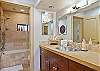 Downstairs bathroom has a shower/bath combination with private vanity sinks in dressing area. All the necessities are accounted for!