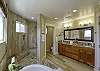 Master bedroom ensuite has double sinks, large soaking tub and walk-in shower.