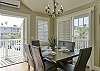 Dining for 6, plus morning breakfast nook seating and bar seating at kitchen counter.