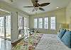 Plenty of natural light. Just off the bedroom and living room are sliding doors for air flow. 

The spiral staircase on the balcony leads to the rooftop for outdoor dining and BBQ.