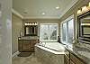 Master suite spa with granite countertops.
