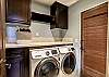 Laundry center has a full size washer and dryer. The laundry room is on the second level, near the second bedroom. Access to the roof deck is through the laundry room.
