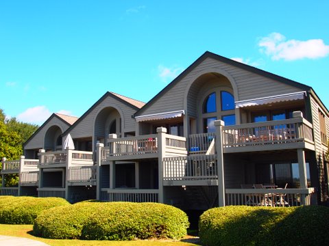 Rear exterior view of Pelican Watch Villas. Each villa has a deck with a beach view