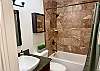 Full bathroom with tub and shower