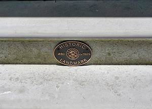 Attached to the entry steps from the city marking the home as an Historical Landmark, Built in 1925