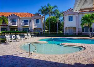 The community pool around the corner, this end offers a shallow play or sitting area to keep cool.