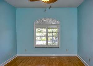 Standing at the spacious walk-in closet looking to he front window in the second guest bedroom.
