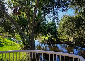 The Master Bedroom has a private balcony with views of the pond and sections of the golf course.