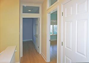 As you reach the top of the stairs to the left are the guest bedroom entries.