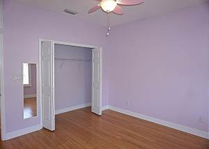 First guest bedroom view from the window corner, the entry door is to the left of the mirror.