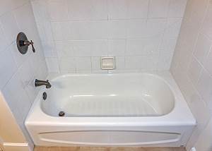 The upstairs Guest Bath offers a soaking tub and shower.
