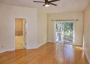 This view shows the balcony and master ensuite bath entry door.