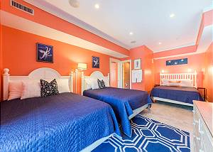 Triple queen bedroom off the pool deck