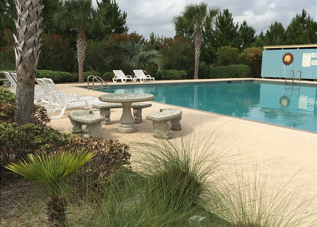 Large outdoor pool by the tennis courts