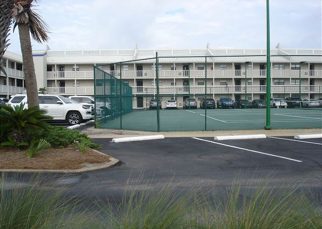 Tennis courts in front of building