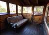 Futon on screened-in porch