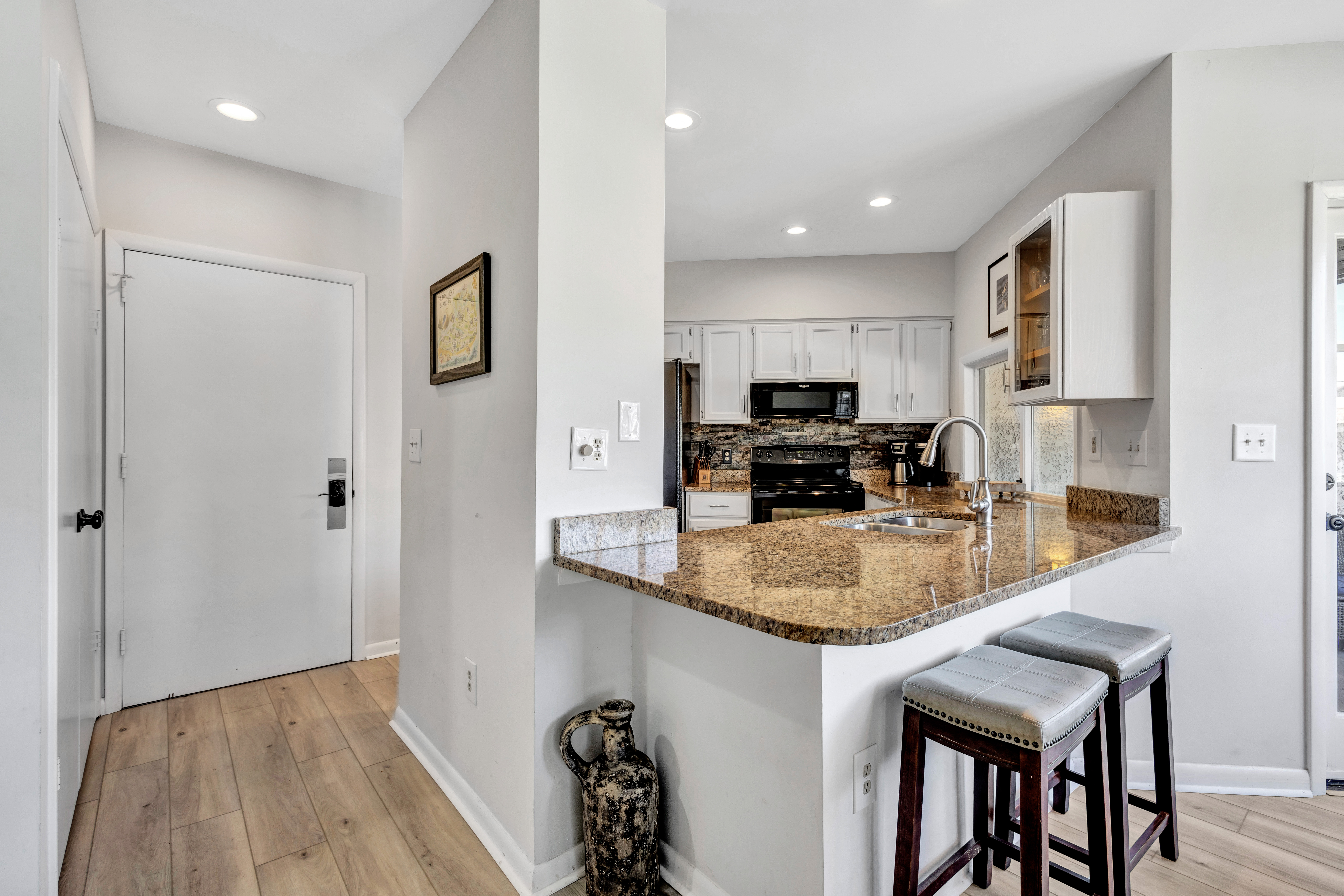 Sleek & Clean Entryway Flowing into Our Gorgeous Kitchen