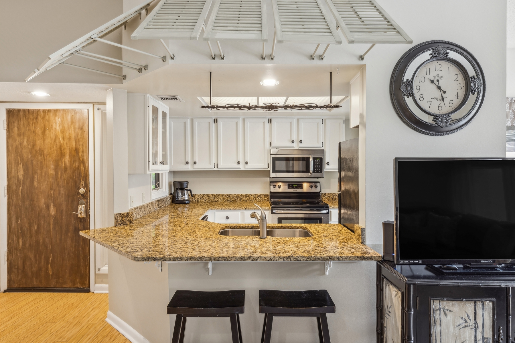 Open Layout Kitchen Connecting Space with Entryway & Living Room