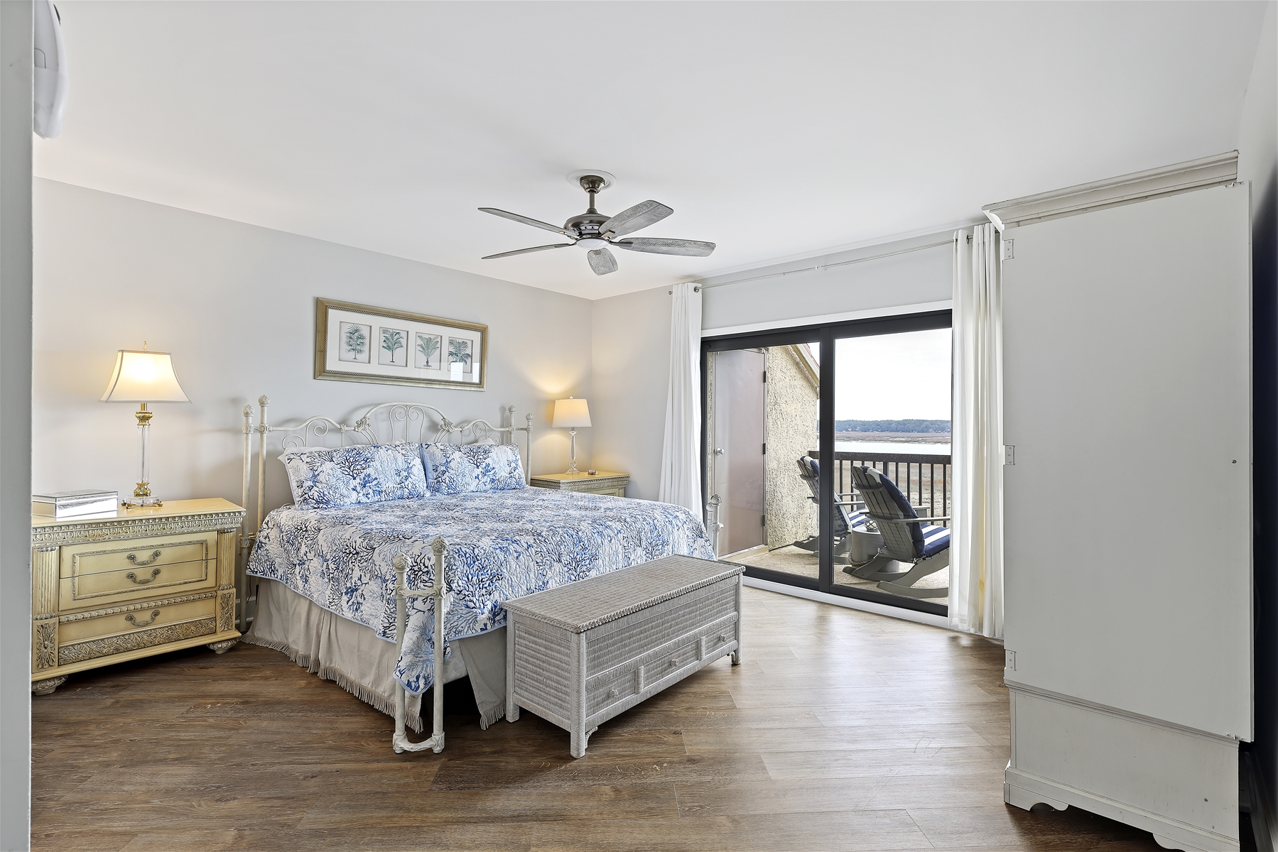 Primary Bedroom: Stylish and Bright Bedroom with a Balcony