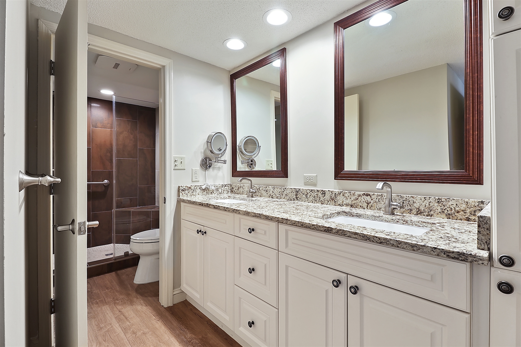 Extra Privacy with a Walk-In Shower and a Dual Sink