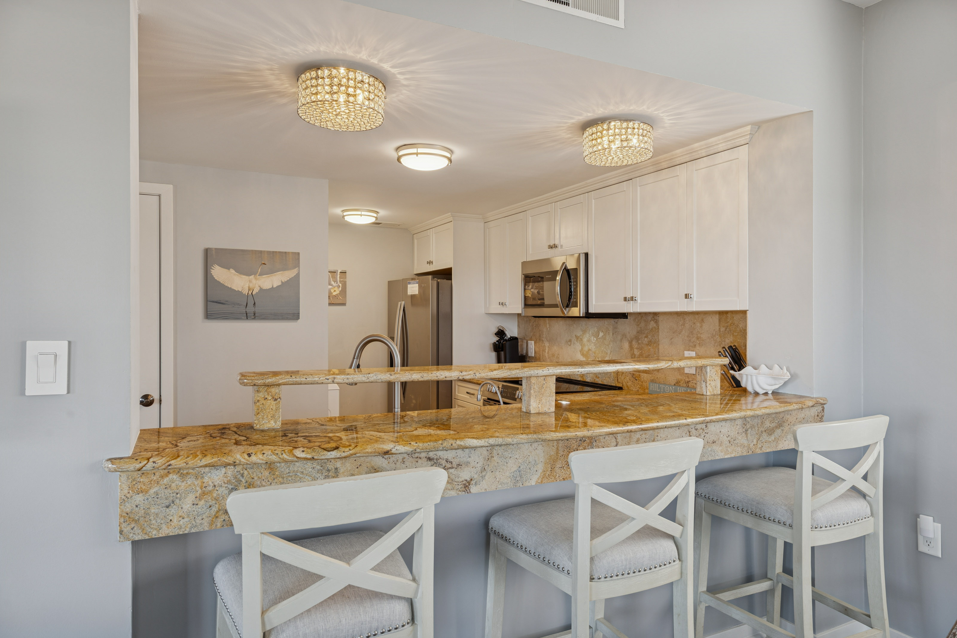 Sleek Barstools with the View into the Kitchen