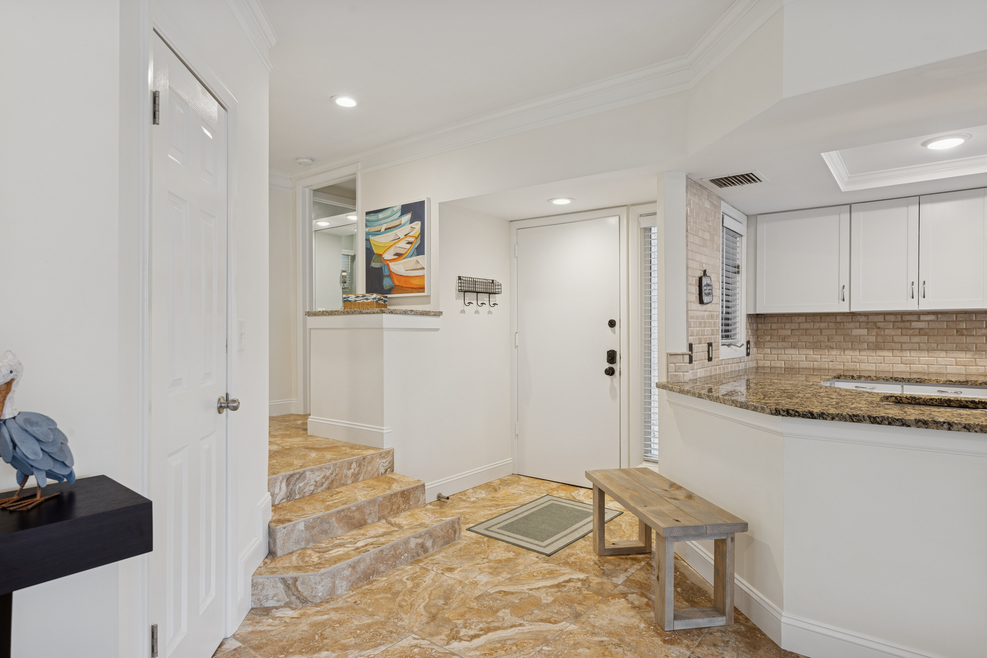 Spacious Entryway with a Bench