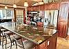 Kitchen w/ Door to BBQ Area w/ Gas Grill