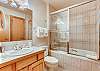 Bathroom ensuite to bedroom with twin beds.