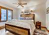 Primary bedroom with king bed and ensuite bathroom